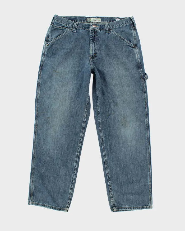 Vintage Y2K Wrangler Medium Wash Carpenter Jeans - W34 L31 sold by Rokit