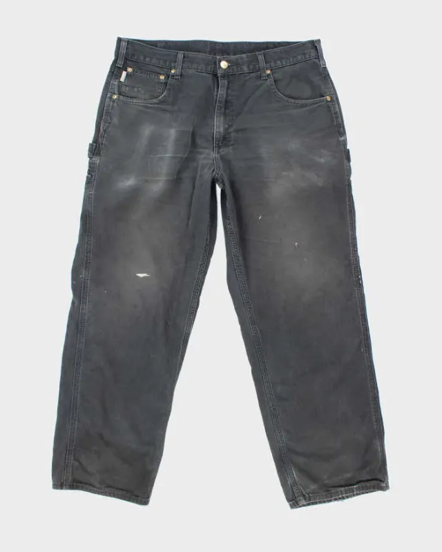 Vintage Carhartt Lightweight Faded Single Knee Carpenter Trousers - W34 L28 sold by Rokit