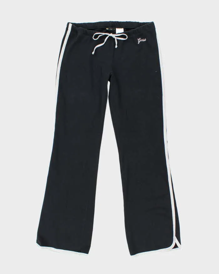 Vintage Y2K Guess Low Waisted Flared Tracksuit Bottoms - L sold by Rokit