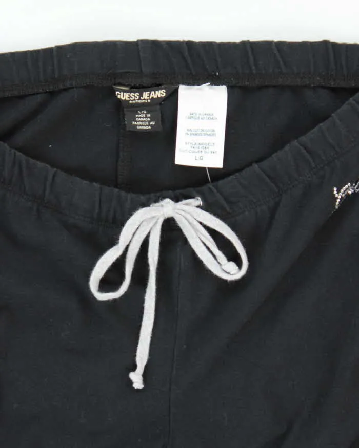 Vintage Y2K Guess Low Waisted Flared Tracksuit Bottoms - L sold by Rokit product image thumbnail 5
