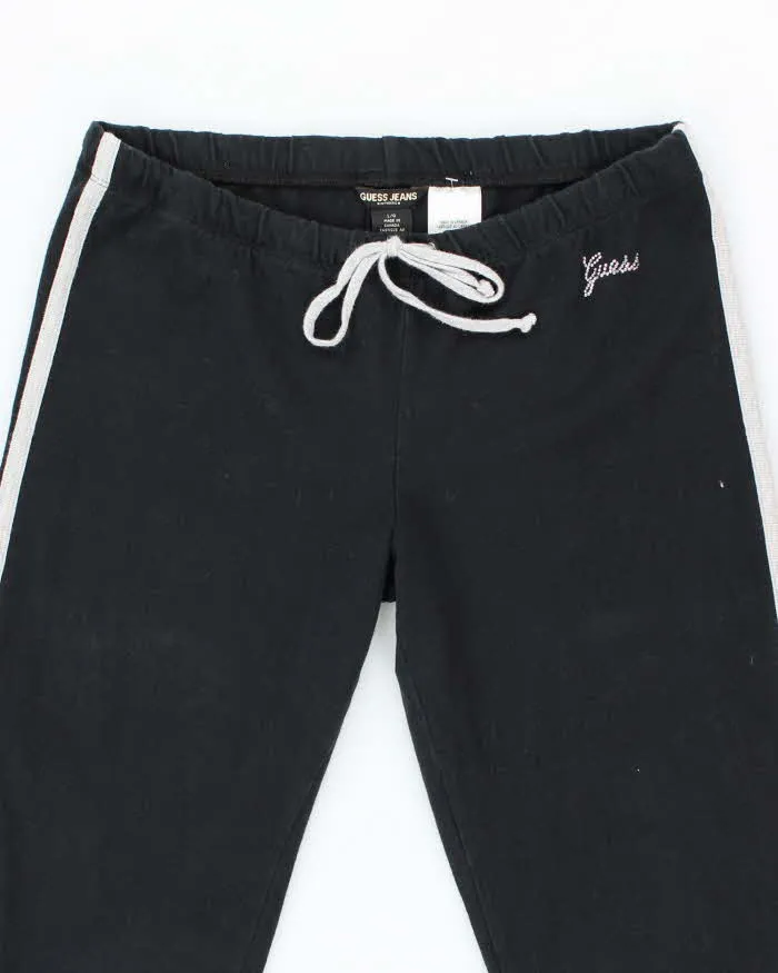 Vintage Y2K Guess Low Waisted Flared Tracksuit Bottoms - L sold by Rokit product image thumbnail 3