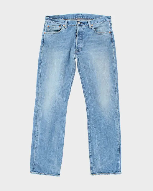Vintage Levi's 501 Medium Wash Jeans - W34 L32 made by Levi's