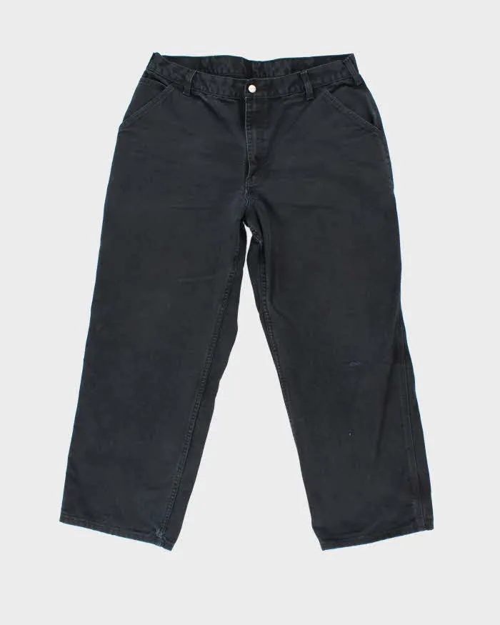 Vintage Carhartt Faded Black Single Knee Carpenter Trousers - W32 L27 sold by Rokit