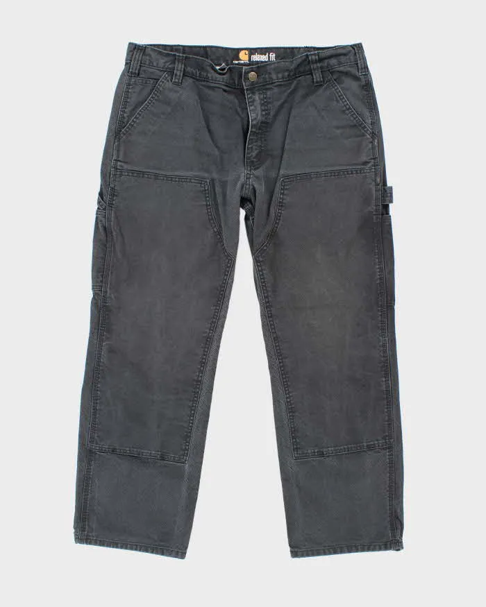 Vintage Carhartt Heavyweight Double Knee Faded Black Carpenter Trousers - W34 L26 sold by Rokit