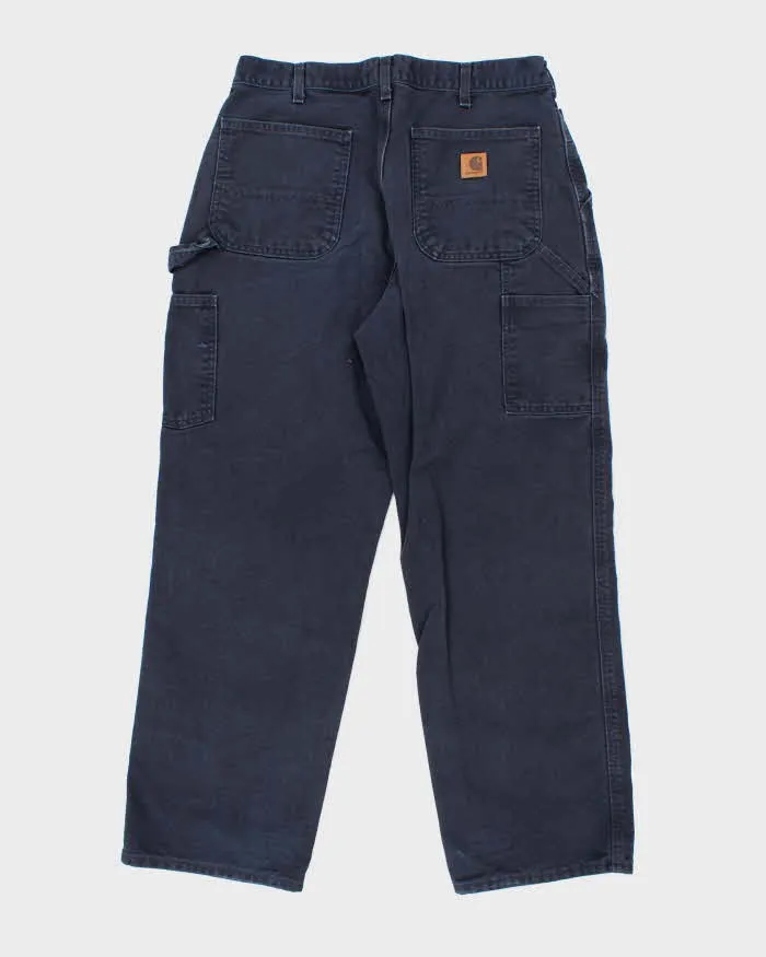 Vintage Carhartt Heavyweight Single Knee Blue Faded Carpenter Trousers - W32 L30 sold by Rokit product image thumbnail 2