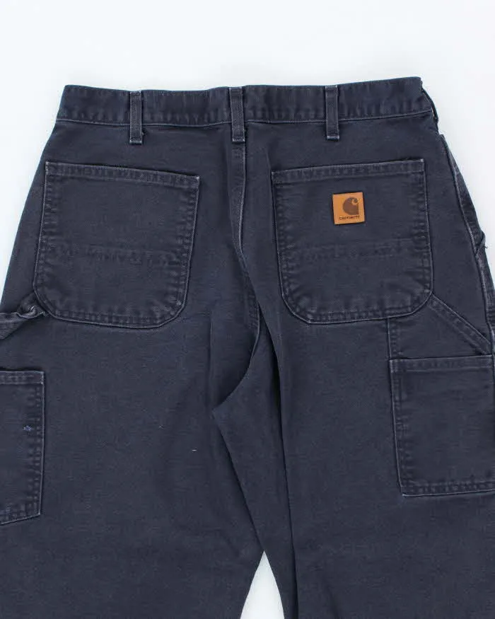 Vintage Carhartt Heavyweight Single Knee Blue Faded Carpenter Trousers - W32 L30 sold by Rokit product image thumbnail 4