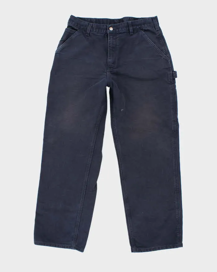 Vintage Carhartt Heavyweight Single Knee Blue Faded Carpenter Trousers - W32 L30 sold by Rokit
