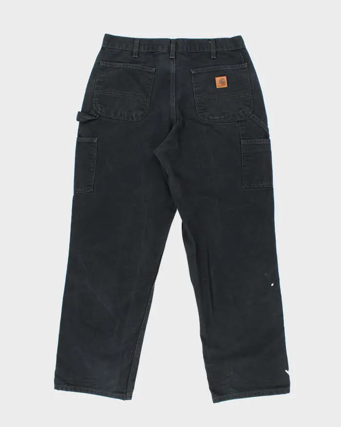 Vintage Carhartt Heavyweight Single Knee Faded Black Carpenter Trousers - W34 L30 sold by Rokit product image thumbnail 2