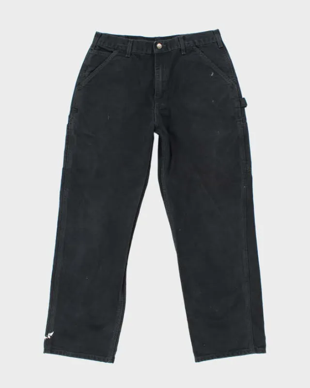 Vintage Carhartt Heavyweight Single Knee Faded Black Carpenter Trousers - W34 L30 sold by Rokit