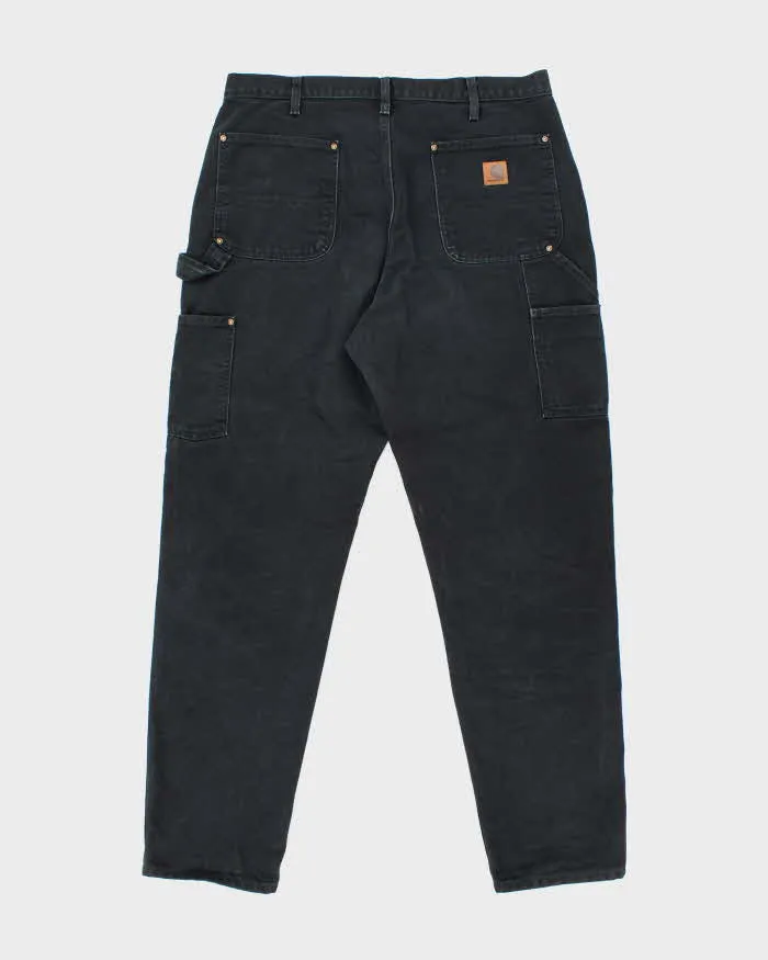 Vintage Carhartt Heavyweight Double Knee Black Carpenter Trousers - W34 L30 sold by Rokit product image thumbnail 2