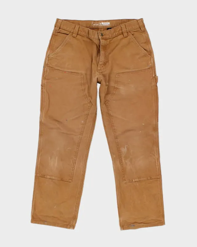 Vintage Carhartt Heavyweight Faded Double Knee Carpenter Trousers - W34 L29 sold by Rokit
