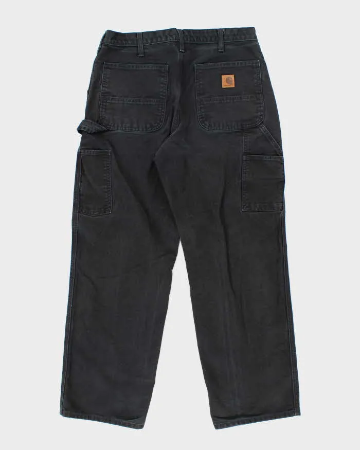 Vintage Carhartt Single Knee Black Faded Carpenter Trousers - W34 L30 sold by Rokit product image thumbnail 2