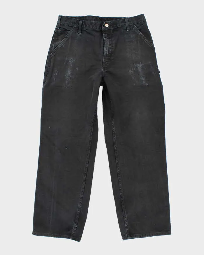 Vintage Carhartt Single Knee Black Faded Carpenter Trousers - W34 L30 sold by Rokit