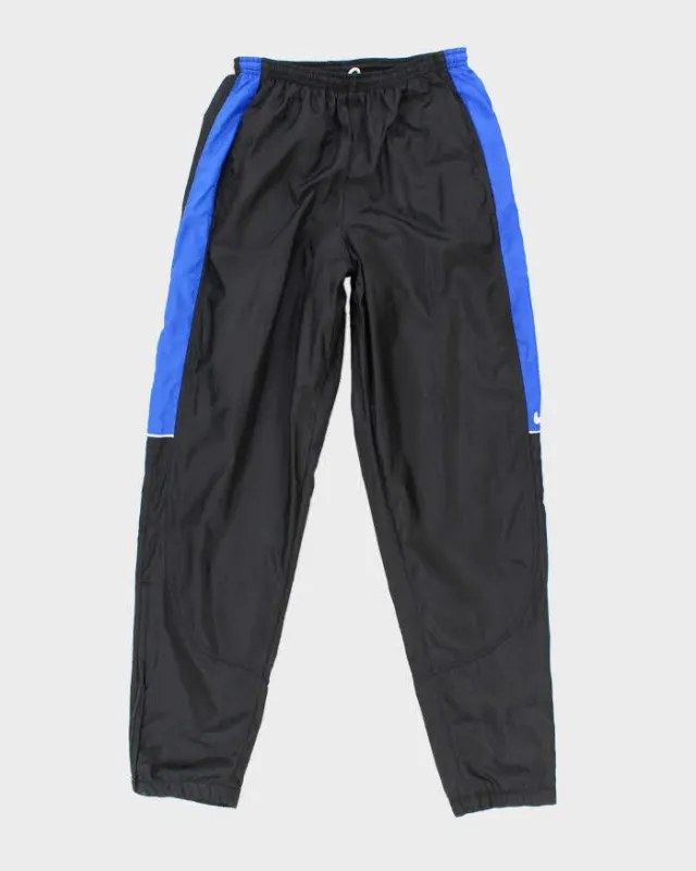 Vintage 90's Nike Side Swoosh Lightweight Tracksuit Bottoms - S sold by Rokit