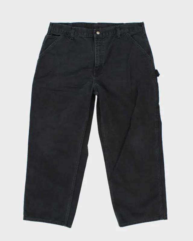Vintage Carhartt Single Knee Black Faded Carpenter Trousers - W38 L26 sold by Rokit