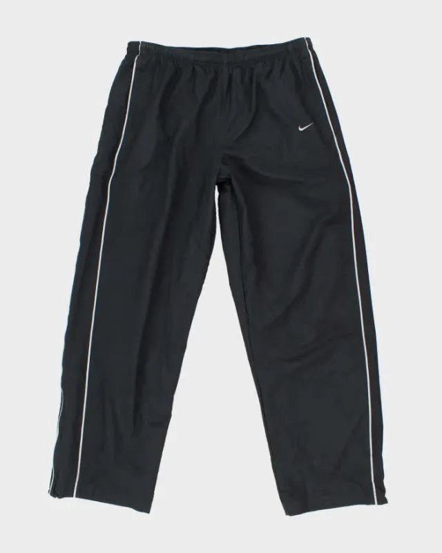Vintage Y2K Nike Open Cuffs Small Swoosh Tracksuit Bottoms - L made by Nike