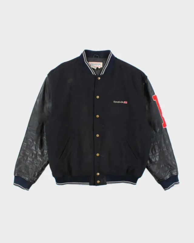 Vintage 80's Reebok Leather Heavyweight Spell Out Varsity Jacket - L sold by Rokit