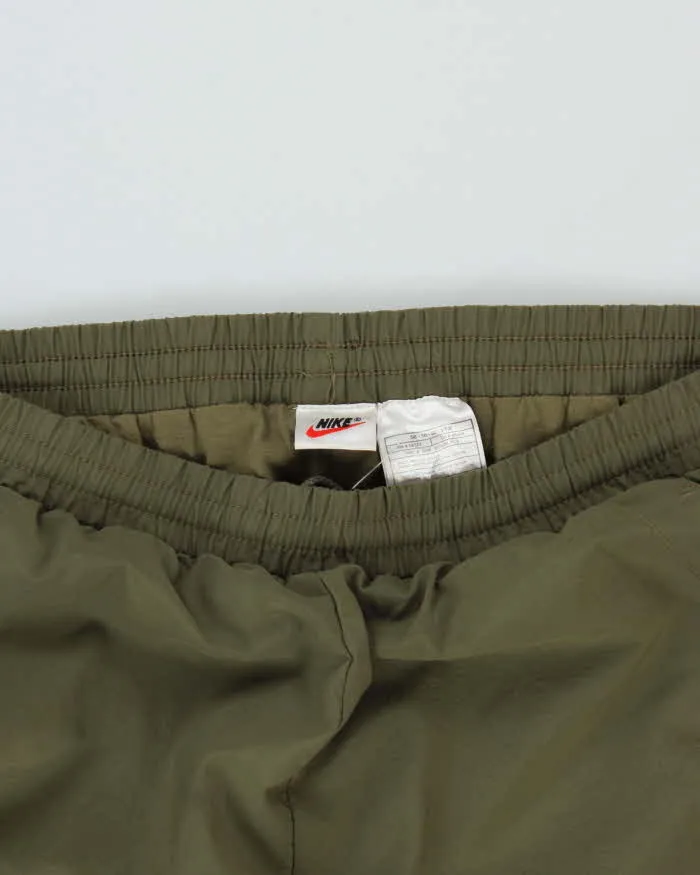 Vintage 1990s Khaki Nike Loose Fit Tracksuit Bottoms - W36 L32 sold by Rokit product image thumbnail 3