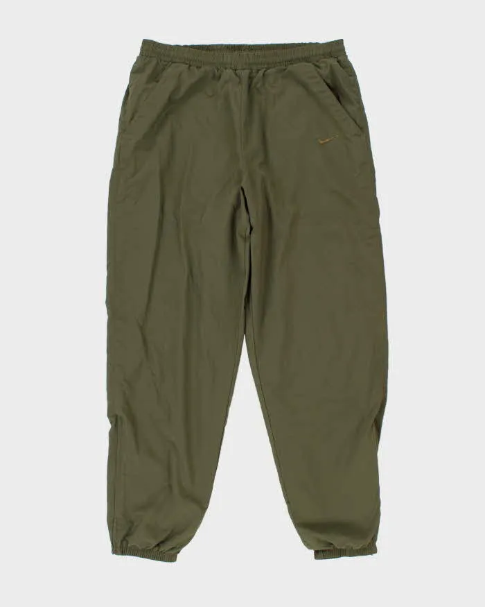 Vintage 1990s Khaki Nike Loose Fit Tracksuit Bottoms - W36 L32 sold by Rokit