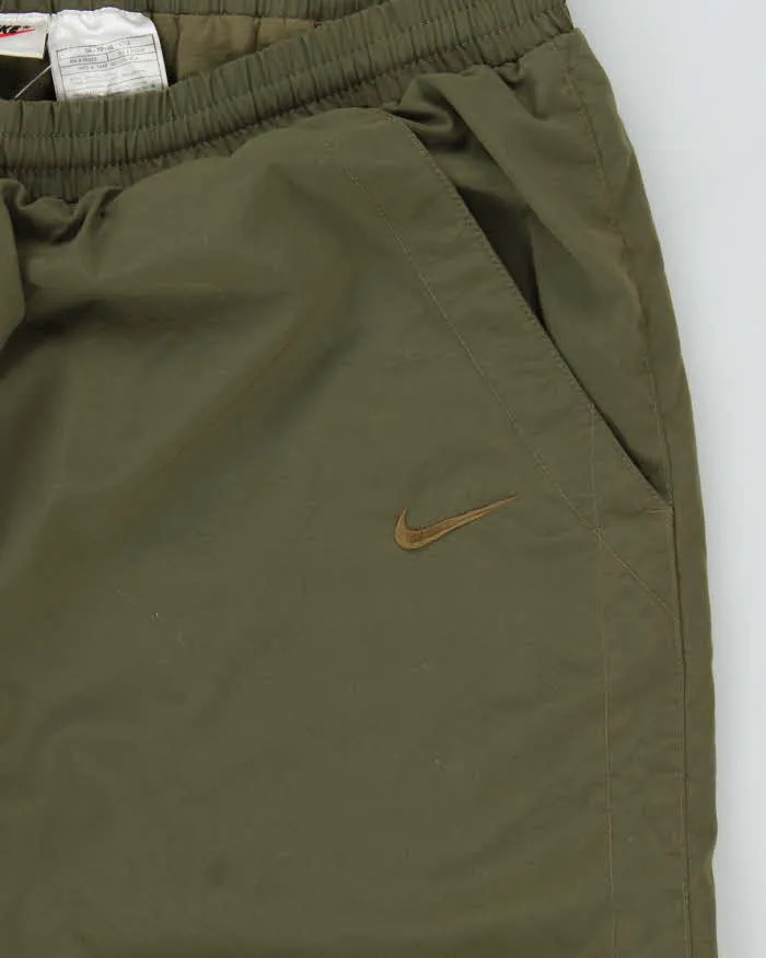 Vintage 1990s Khaki Nike Loose Fit Tracksuit Bottoms - W36 L32 sold by Rokit product image thumbnail 4