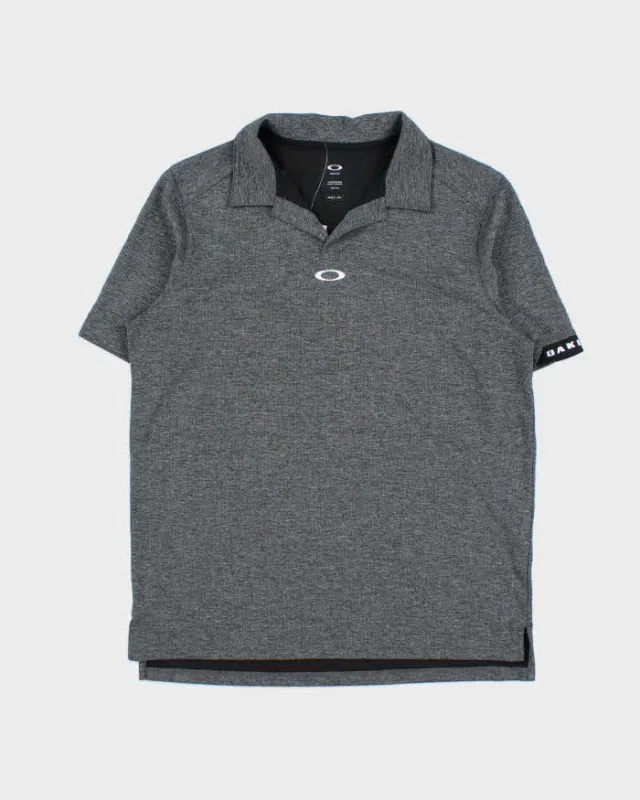 Vintage Oakley Centre Logo Poly Short Sleeve Polo Shirt - M sold by Rokit
