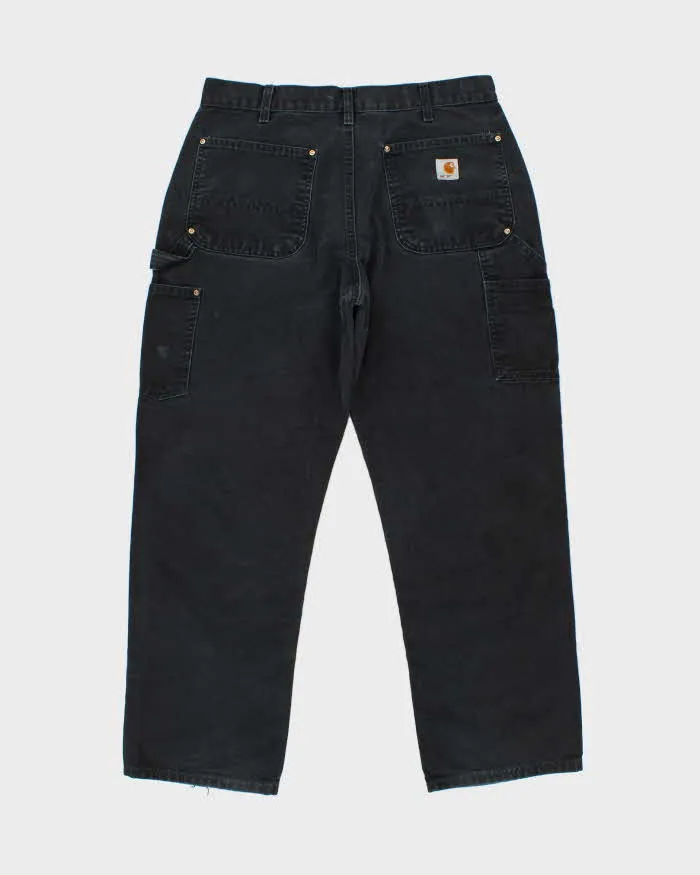 Vintage Carhartt Double Front Duck Loose Straight Workwear Trousers - W34 L29 sold by Rokit product image thumbnail 2