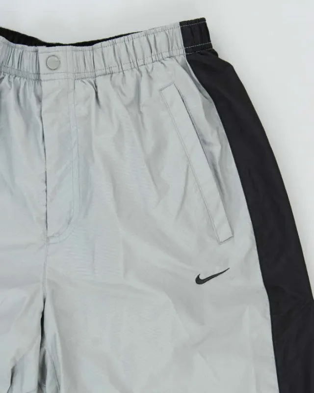 Vintage 00s Nike Soft Shell Tracksuit Bottoms - M sold by Rokit