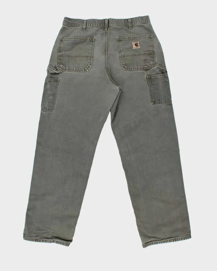 Vintage Y2K 00s Carhartt Khaki Dungaree Fit Wide Leg Distressed Workwear Trousers - W34 L32 sold by Rokit product image thumbnail 2
