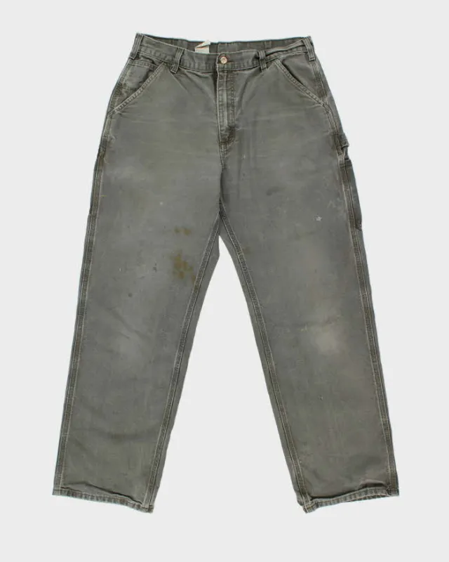 Vintage Y2K 00s Carhartt Khaki Dungaree Fit Wide Leg Distressed Workwear Trousers - W34 L32 sold by Rokit