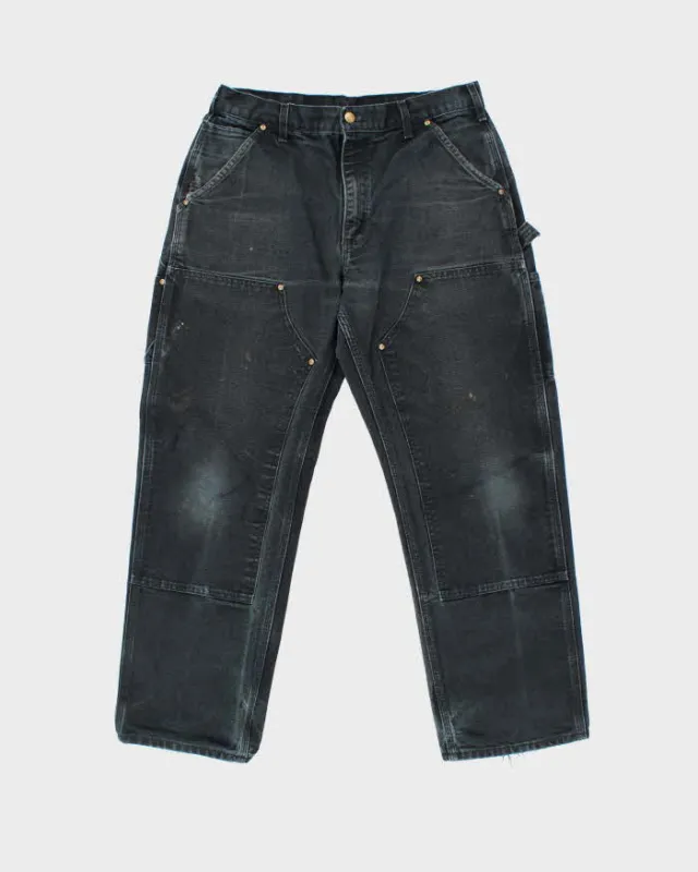 Vintage Carhartt B01 BLK Duck Canvas Double Front Loose Fit Made In USA Distressed Carpenter Trousers - W33 L30 sold by Rokit