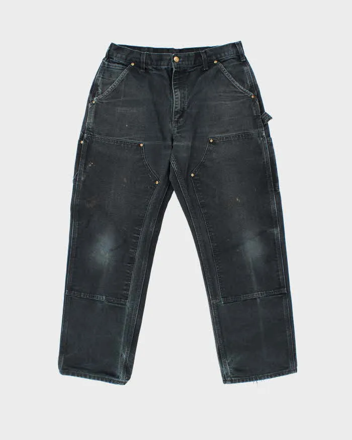 Vintage Carhartt B01 BLK Duck Canvas Double Front Loose Fit Made In USA Distressed Carpenter Trousers - W33 L30 sold by Rokit