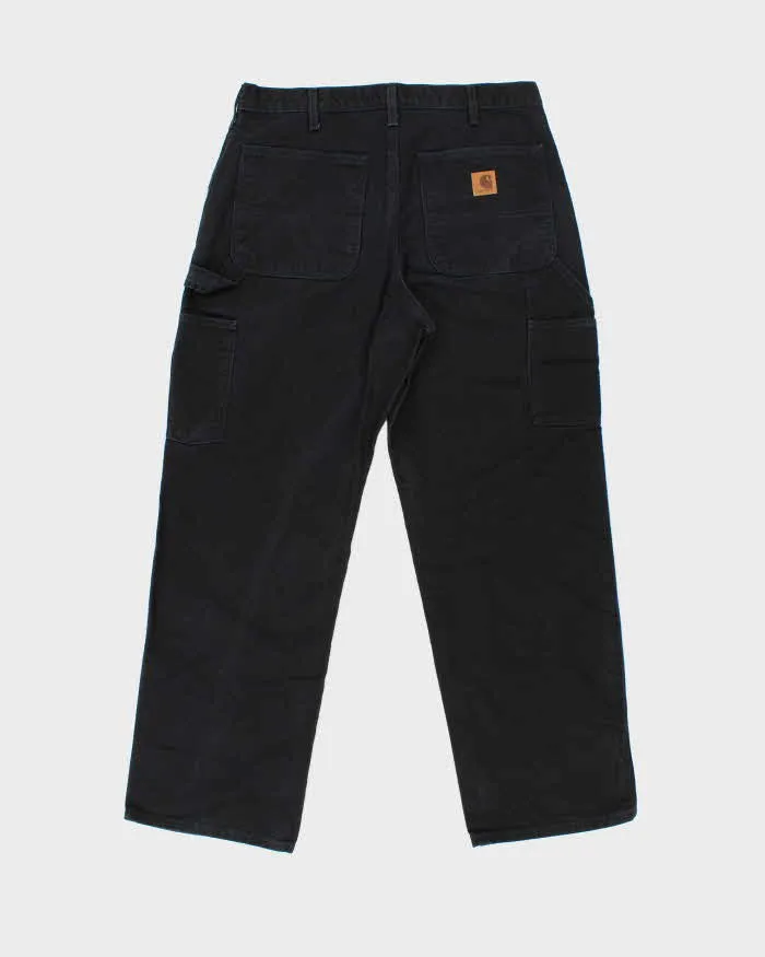 Vintage Carhartt B11 BLK Loose Fit Duck Cotton Workwear Trousers - W33 L30 sold by Rokit product image thumbnail 2