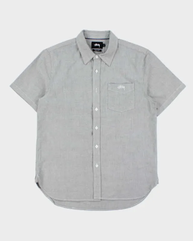 Vintage Stussy Chambray Embroidered Short Sleeve Pocket Shirt - S sold by Rokit
