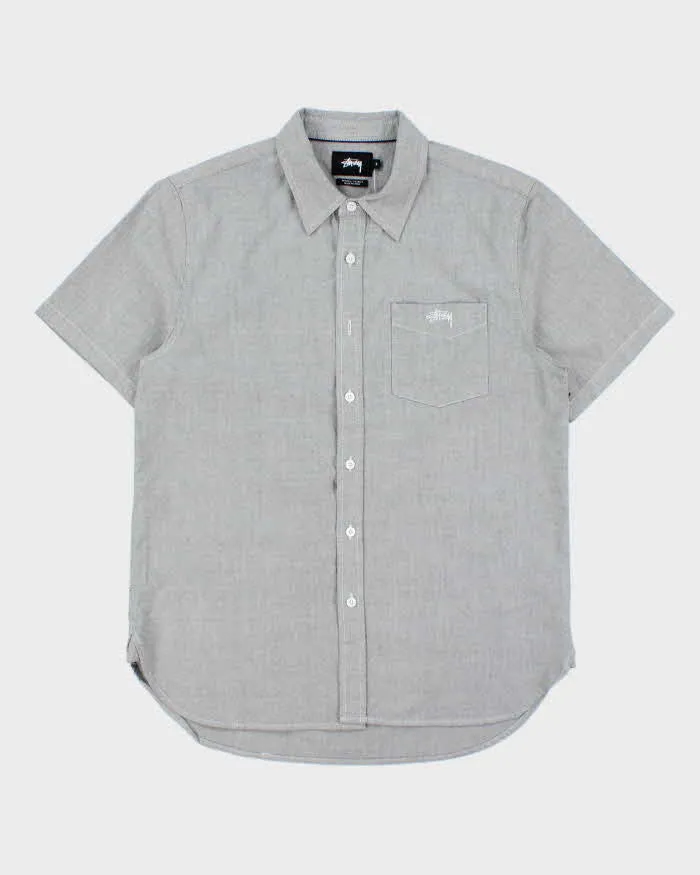 Vintage Stussy Chambray Embroidered Short Sleeve Pocket Shirt - S sold by Rokit