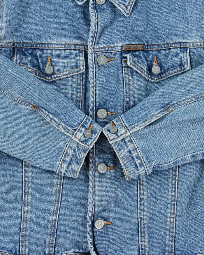 Vintage 1990s Calvin Klein Women's Medium Wash Cropped Denim Jacket - L sold by Rokit product image thumbnail 4