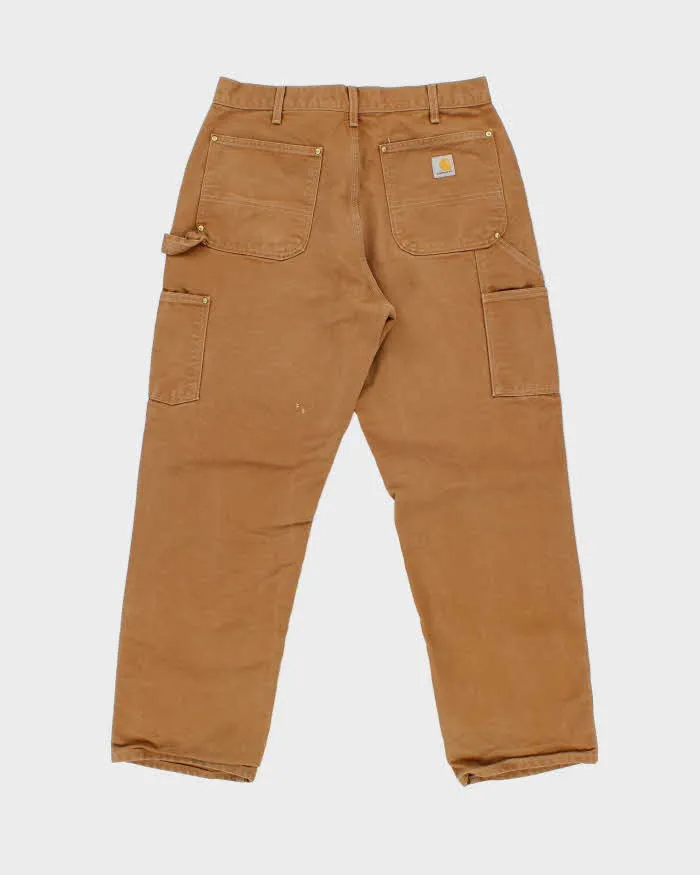 Vintage Carhartt B01 BRN Made In USA Firm Duck Double-Front Loose Fit Carpenter Trousers - W34 L30 sold by Rokit product image thumbnail 2