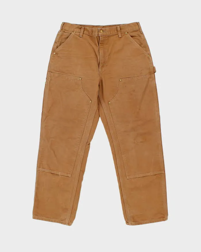 Vintage Carhartt B01 BRN Made In USA Firm Duck Double-Front Loose Fit Carpenter Trousers - W34 L30 sold by Rokit