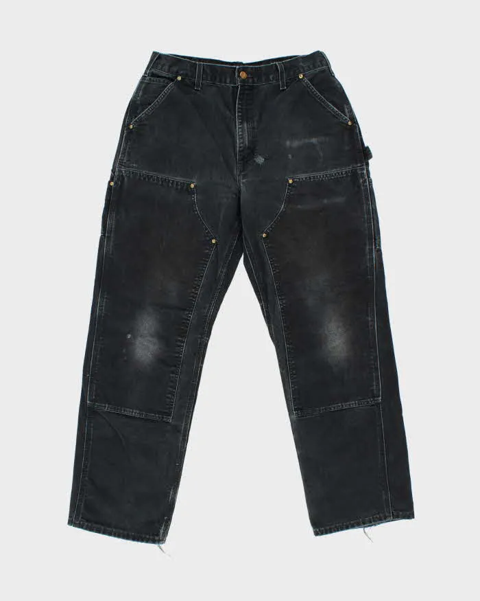 Vintage Carhartt B01 BLK Duck Canvas Double Knee Made In USA Distressed Loose Original Fit Carpenter Trousers - W32 L30 sold by Rokit