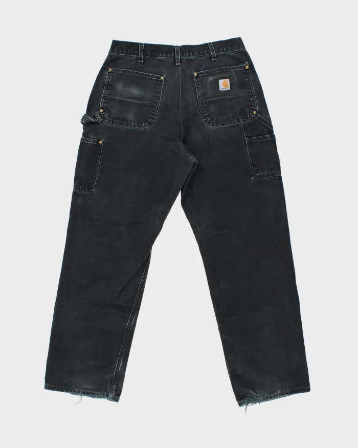 Vintage Carhartt B01 BLK Duck Canvas Double Knee Made In USA Distressed Loose Original Fit Carpenter Trousers - W32 L30 sold by Rokit product image thumbnail 2