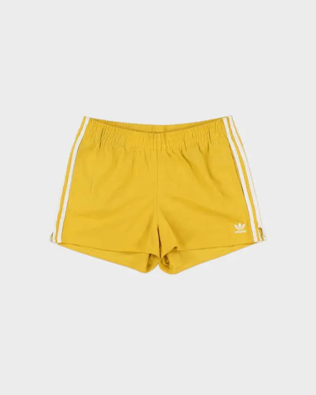 Vintage Adidas Originals Women's Mustard 3-Stripe Firebird Shorts - M made by Adidas