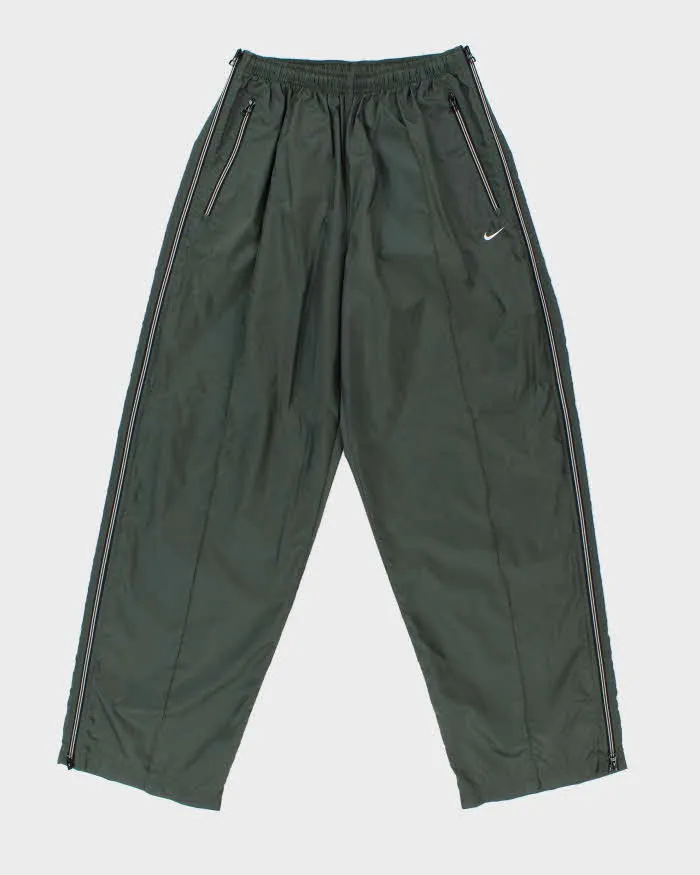 Vintage 1990s Nike Khaki Lightweight Waterproof Shell Baggy Wide Leg Zip Tracksuit Bottoms - XL sold by Rokit