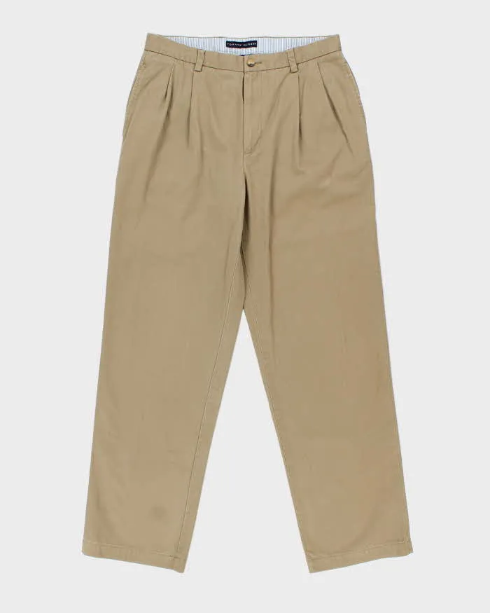 Vintage Y2K 00s Tommy Hilfiger Khaki Double Pleated Relaxed Fit Wide Leg Chino Trousers - W34 L33 sold by Rokit