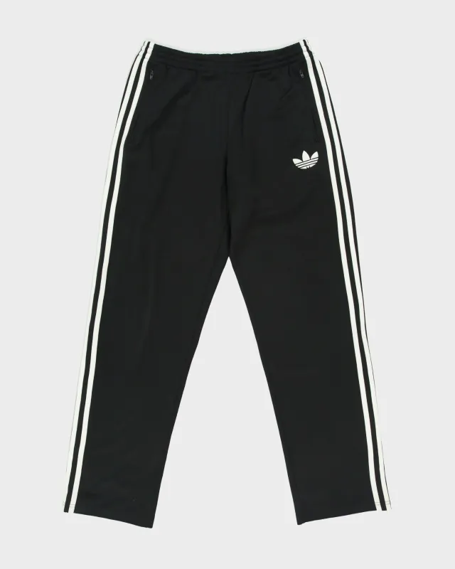Vintage Adidas Originals Black Classic Firebird Relaxed Fit Zip Cuff Tracksuit Bottoms - M made by Adidas