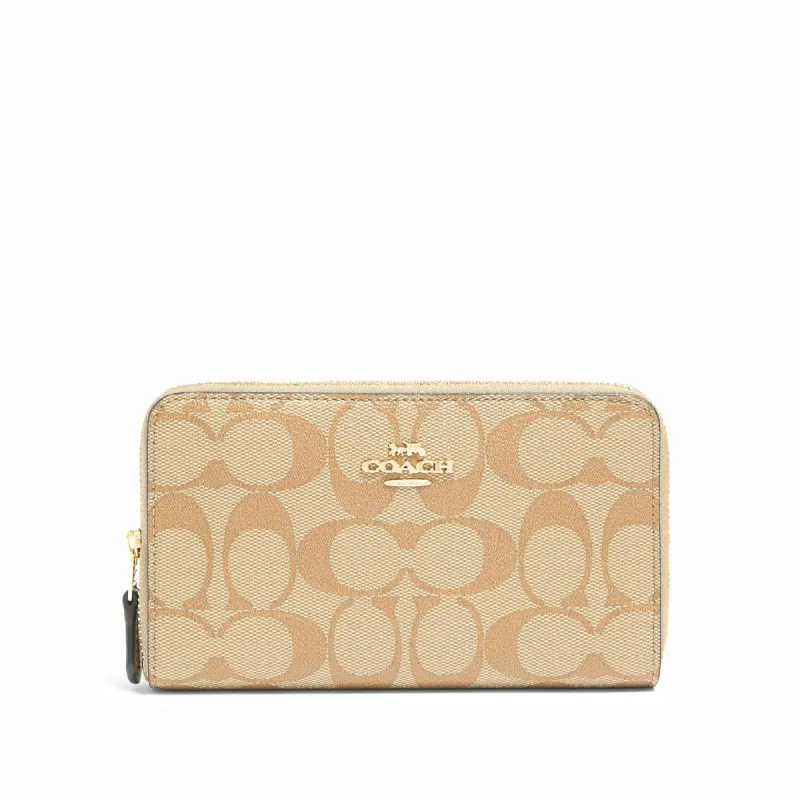 Coach Women's Medium Id Zip Wallet In Signature Canvas sold by Ruumur