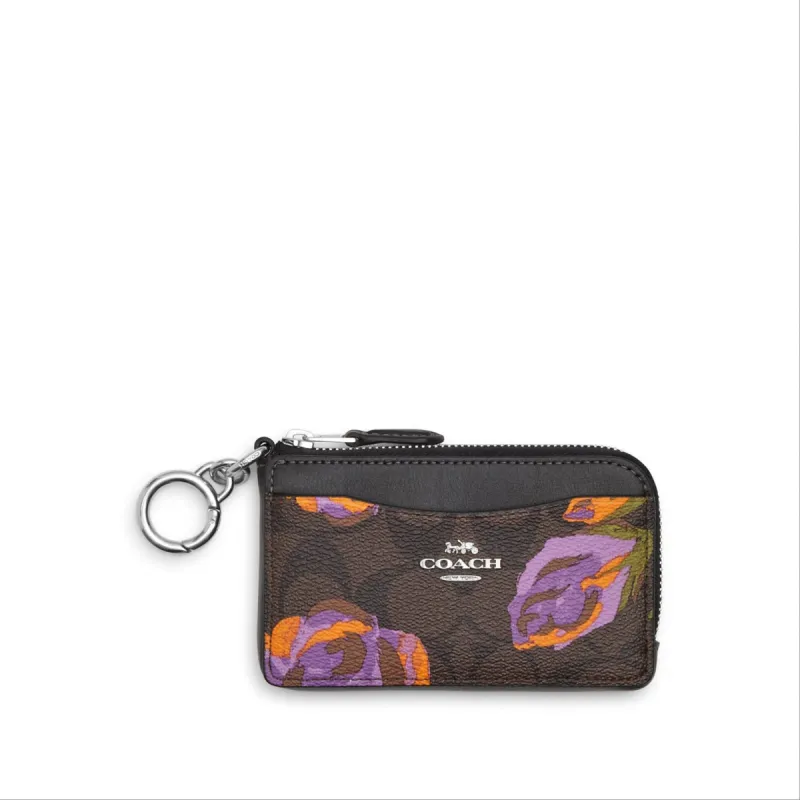 Coach Multifunction Card Case In Signature Canvas With Rose Print sold by Ruumur