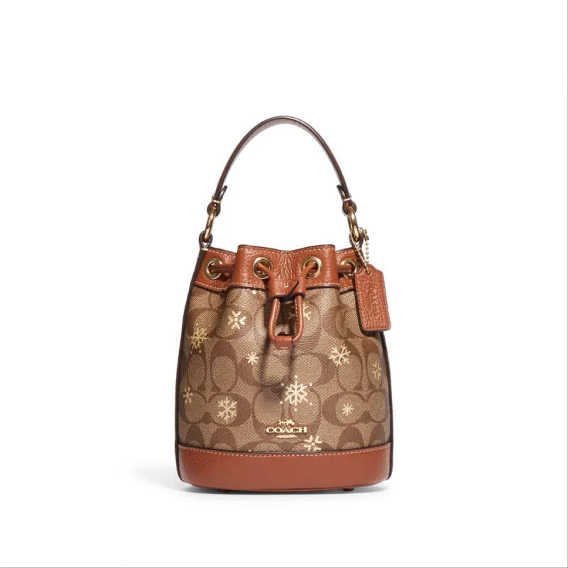 Coach Dempsey Drawstring Bucket Bag 15 In Signature Canvas With Snowflake Print sold by Ruumur