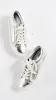 Tory Burch
Tory Sport Ruffle Sneaker sold by Ruumur