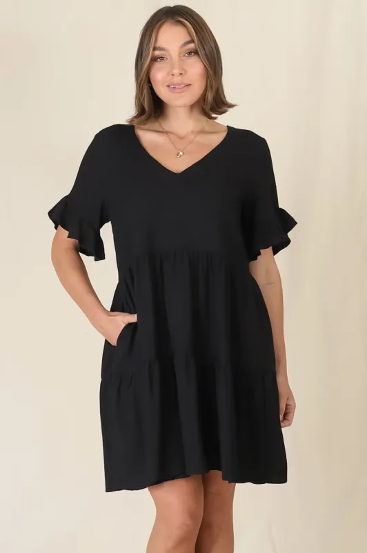 Audrina Mini Dress - Pull Over V Neck Tiered Dress with Pockets in Black sold by Salty Crush