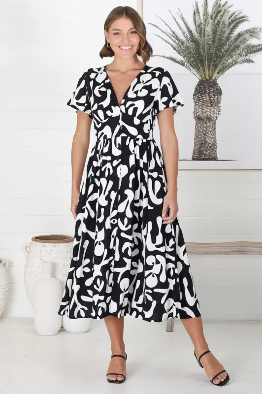 Loya Midi Dress - A Line Cap Sleeve Button Down Dress in Jaxie Print Black sold by Salty Crush