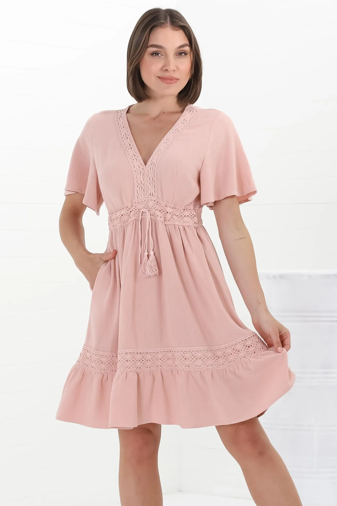 Kimmy Mini Dress - Lace Detailed Cape Sleeve Dress with Pull Tie Waist in Blush sold by Salty Crush